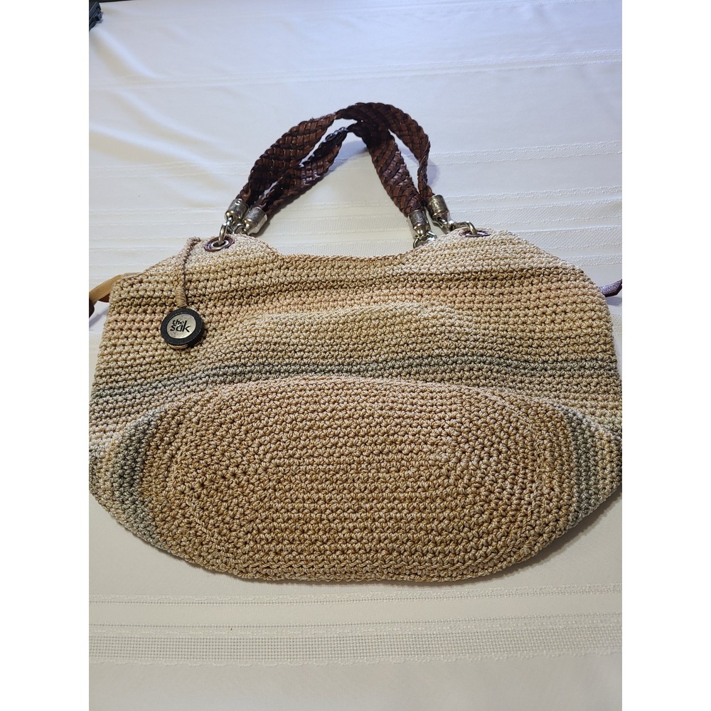 The Sak Indio crochet hobo shoulder bag  striped pattern with a braided handle.